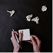 Hands working on a device or document, representing professional results delivered to clients.