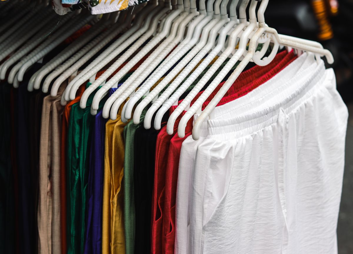 Knit trousers in many colors on hangers